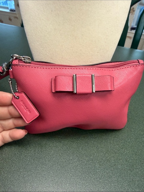 Coach Handbags - Coach Pink Saffiano Leather Wristlet with Bow Accent